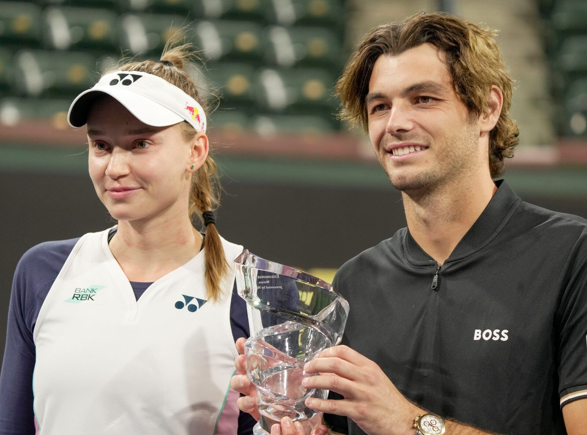 Elena Rybakina, left, and Taylor Fritz hold the trophy after winning the Eisenhower Cup Tie Break Tens during the BNP Paribas Open in Indian Wells, Calif., March 4, 2025.