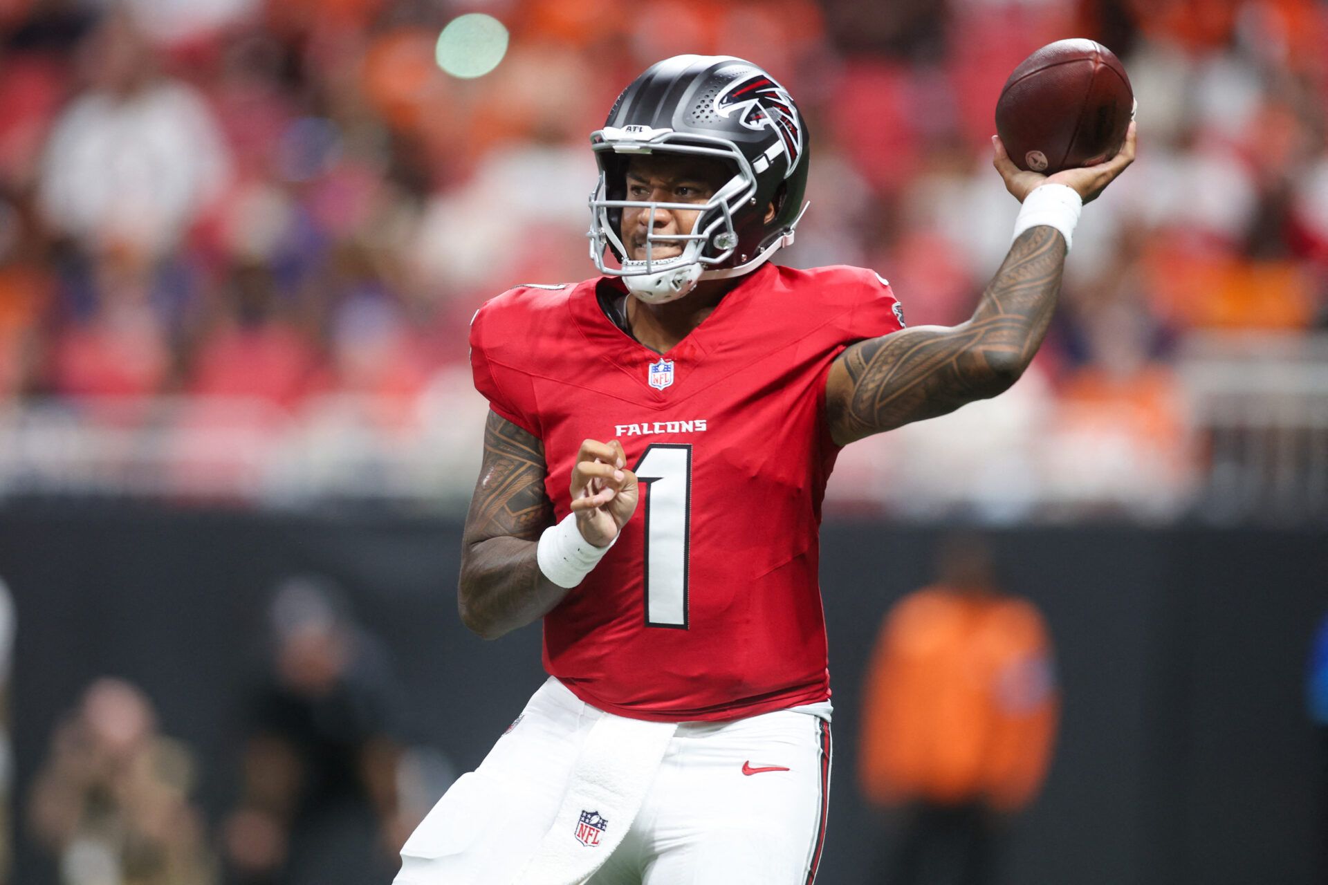 Atlanta Falcons quarterback Tua Tagovailoa (1) throws a pass against the Denver Broncos in the first quater at Mercedes-Benz Stadium.