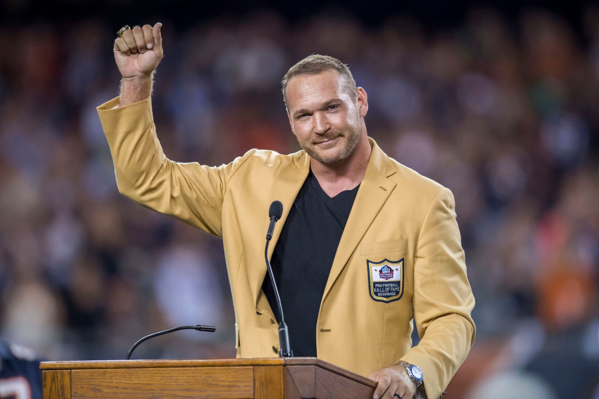 Chicago Bears former player Brian Urlacher is honored during halftime of a game between the Chicago Bears and the Seattle Seahawks at Soldier Field.