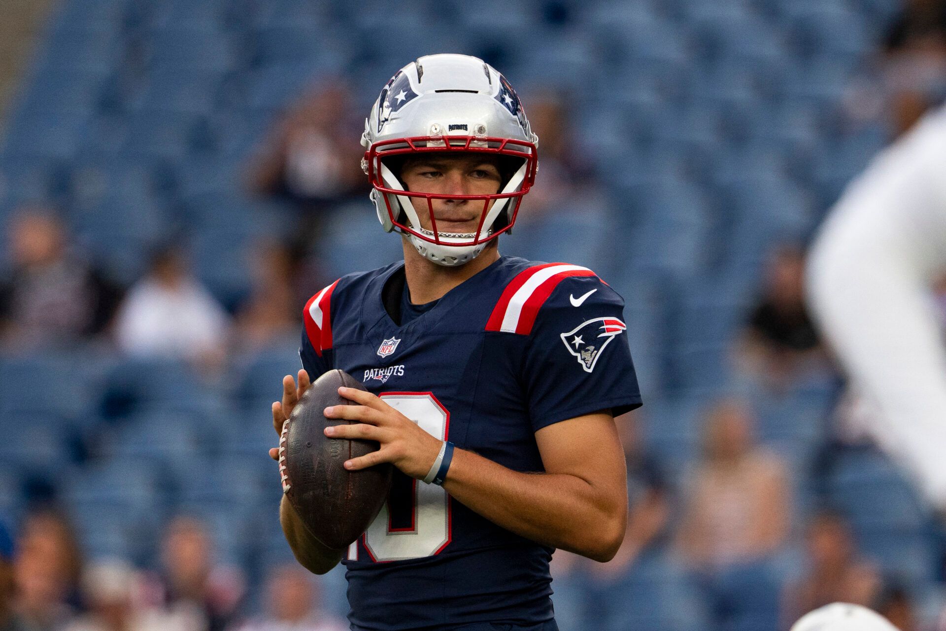 New England Patriots quarterback Drake Maye (10) warms up before a preseason game against the Indianapolis Colts at Gillette Stadium.