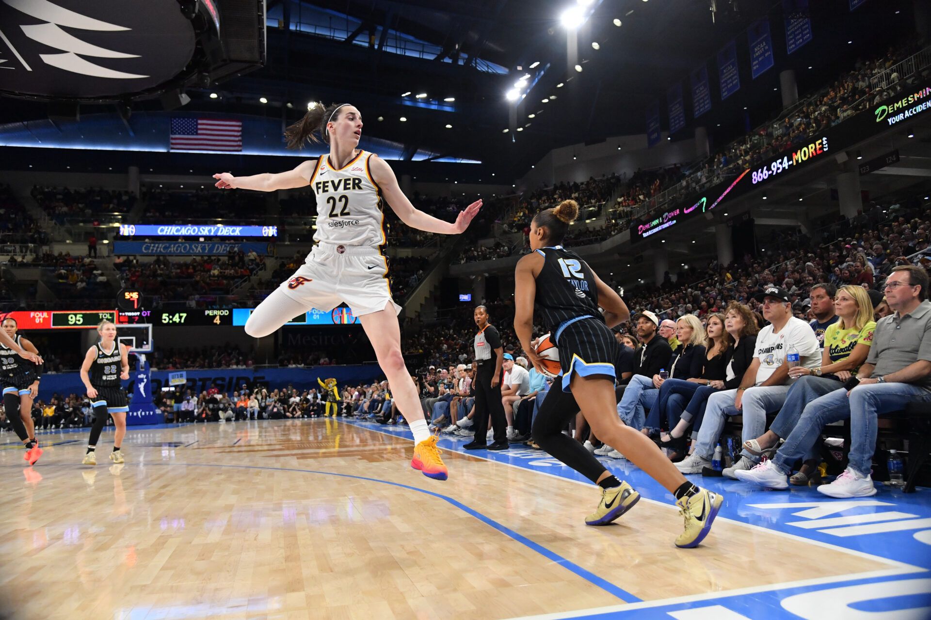 Indiana Fever guard Caitlin Clark (22) attempts to block Chicago Sky guard Sydney Taylor (12) during the second half at Wintrust Arena.
