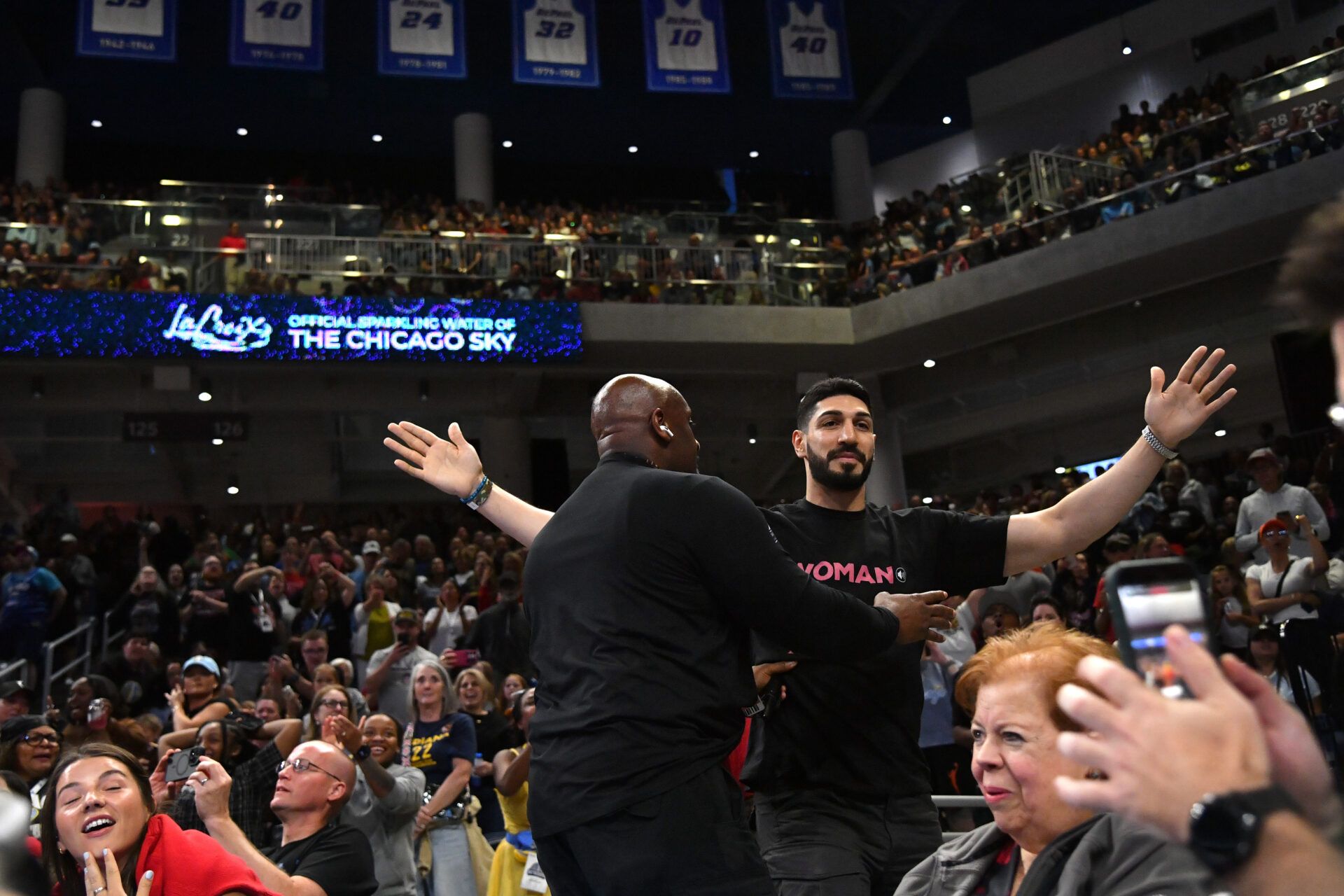Turkish-American former basketball player and human rights activist Enes Kanter Freedom reacts as he is removed from the arena during the second half against the Indiana Fever at Wintrust Arena.