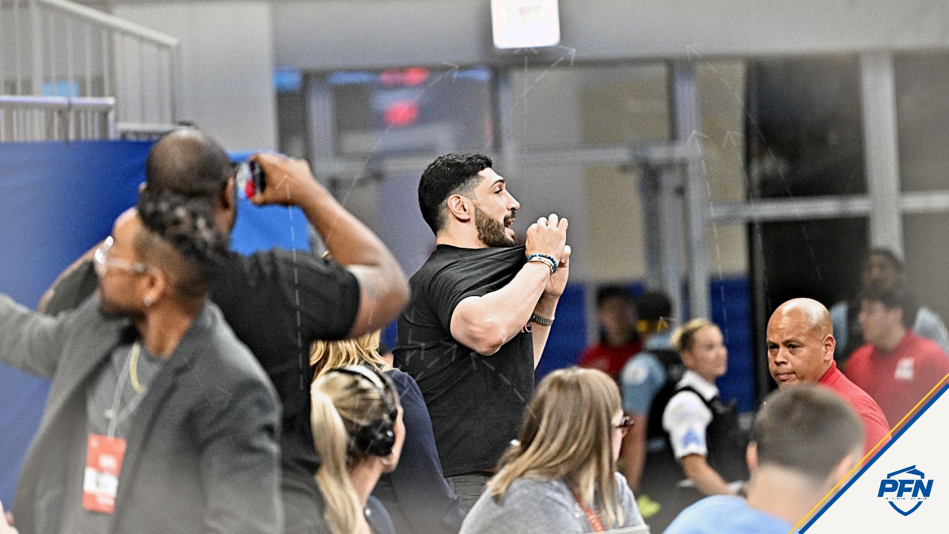 Turkish-American former basketball player and human rights activist Enes Kanter Freedom is removed from the arena during the second half against the Indiana Fever at Wintrust Arena.