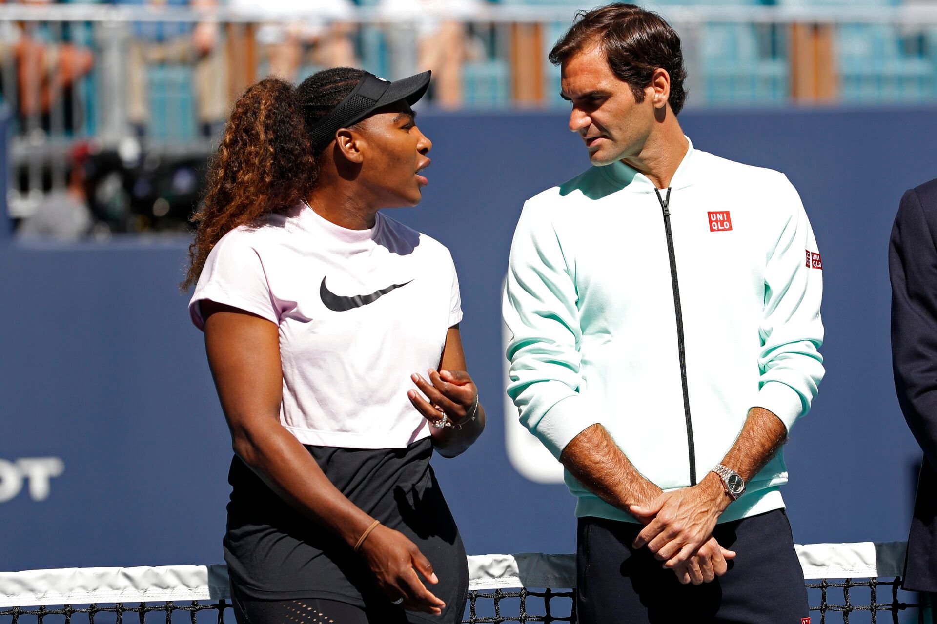 Serena Williams of the United States (L) speaks with Roger Federer of Switzerland (R) during a ribbon cutting ceremony on new stadium court at Hard Rock Stadium prior to play in the first round of the Miami Open at Miami Open Tennis Complex.
