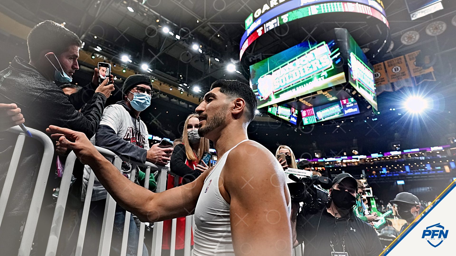 Boston Celtics center Enes Kanter (13) signs autographs before the start of the game against the Toronto Raptors at TD Garden.