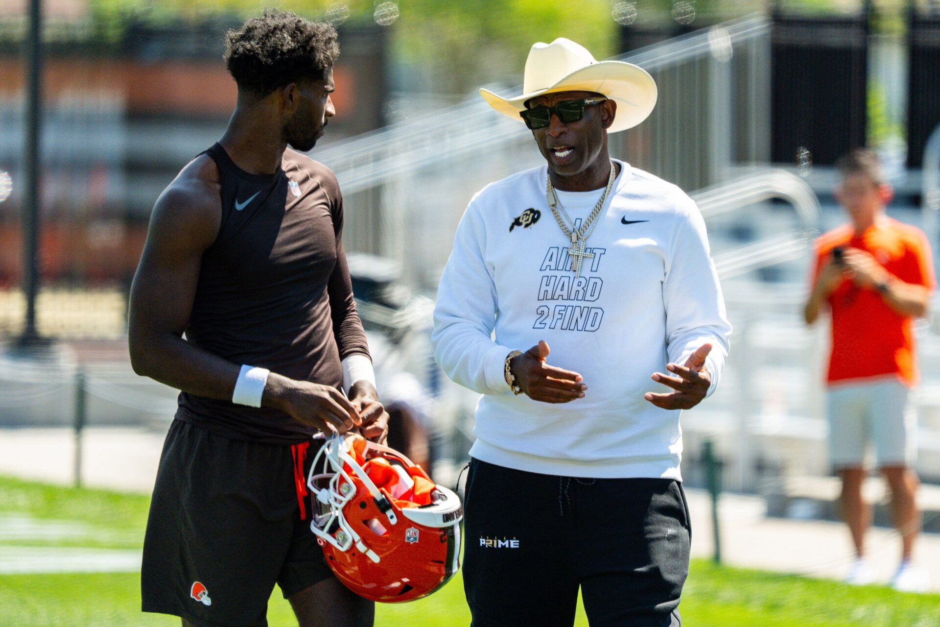 Deion Sanders spends time with his son, Cleveland Browns quarterback Shedeur Sanders (2) at the conclusion of the second day of training camp, July 30, 2026, in Berea, Ohio.