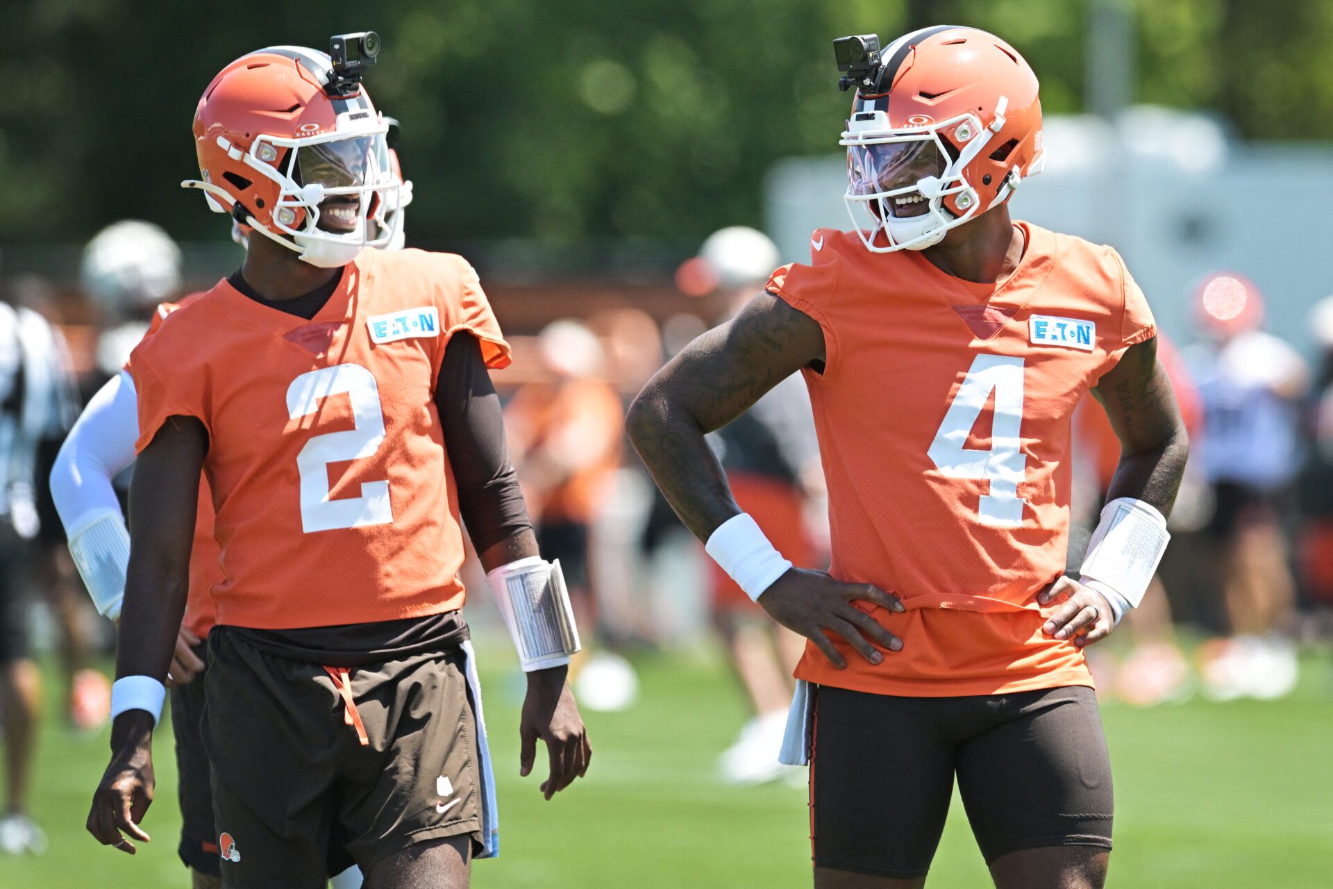 Cleveland Browns quarterback Shedeur Sanders (2) and quarterback Deshaun Watson (4) talk during training camp at CrossCountry Mortgage Campus.