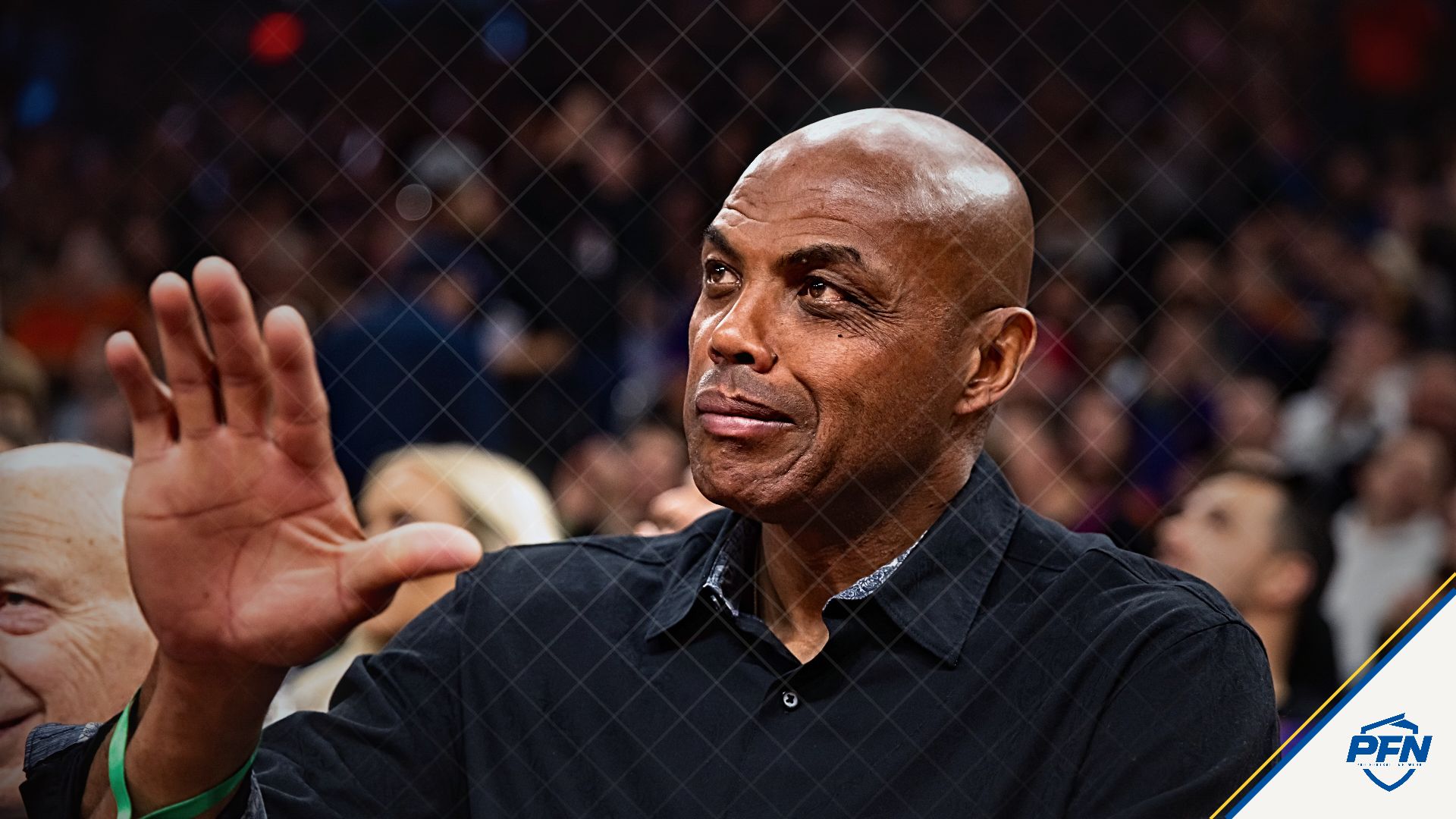 Phoenix Suns former player Charles Barkley sits courtside against the Minnesota Timberwolves during an NBA Cup game at Mortgage Matchup Center.