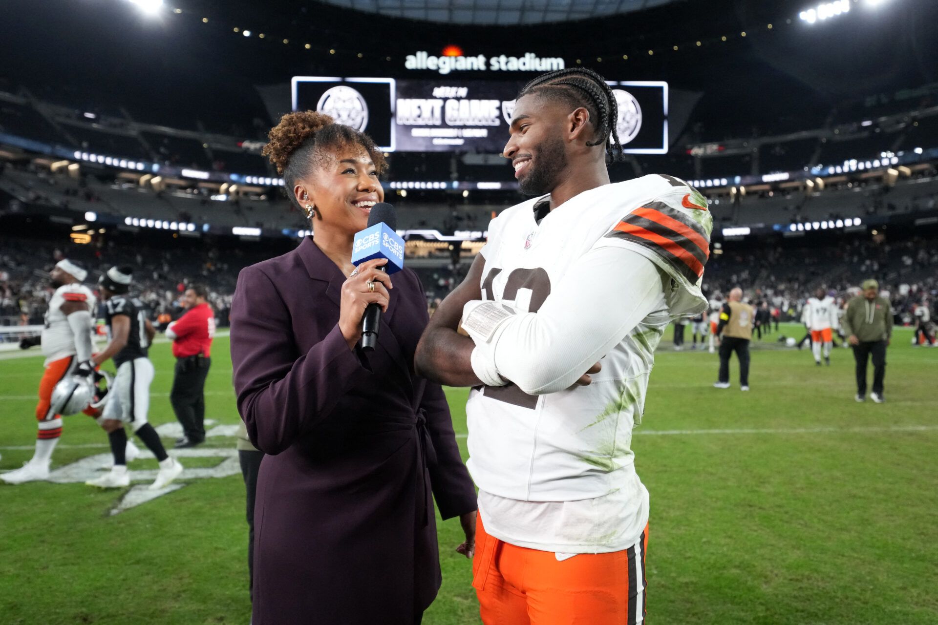 CBS Sports reporter Tiffany Blackmon (left) interviews Cleveland Browns quarterback Shedeur Sanders (12) after the game against the Las Vegas Raiders at Allegiant Stadium.
