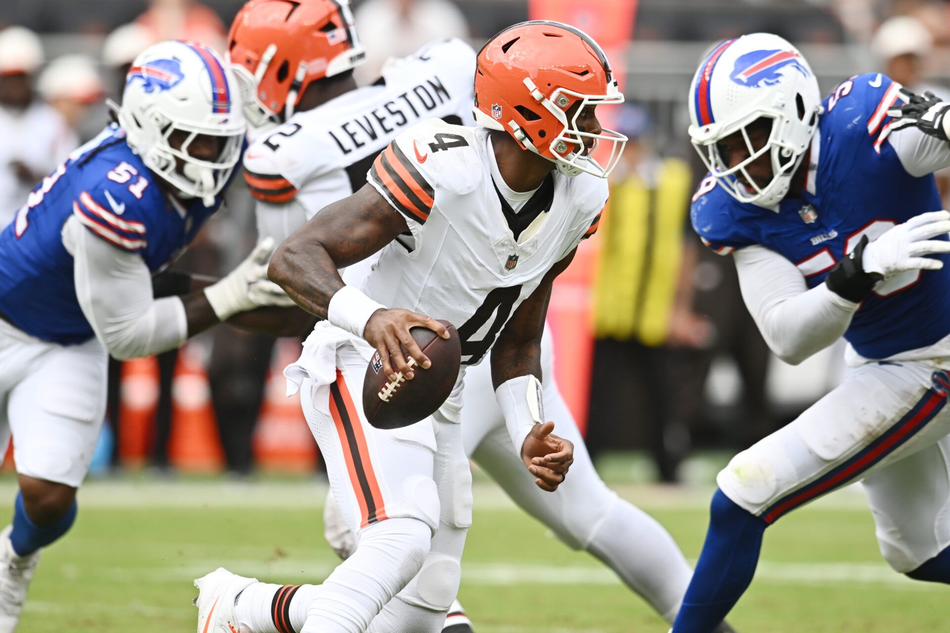 Cleveland Browns quarterback Deshaun Watson (4) scrambles during the second half against the Buffalo Bills at Huntington Bank Field.