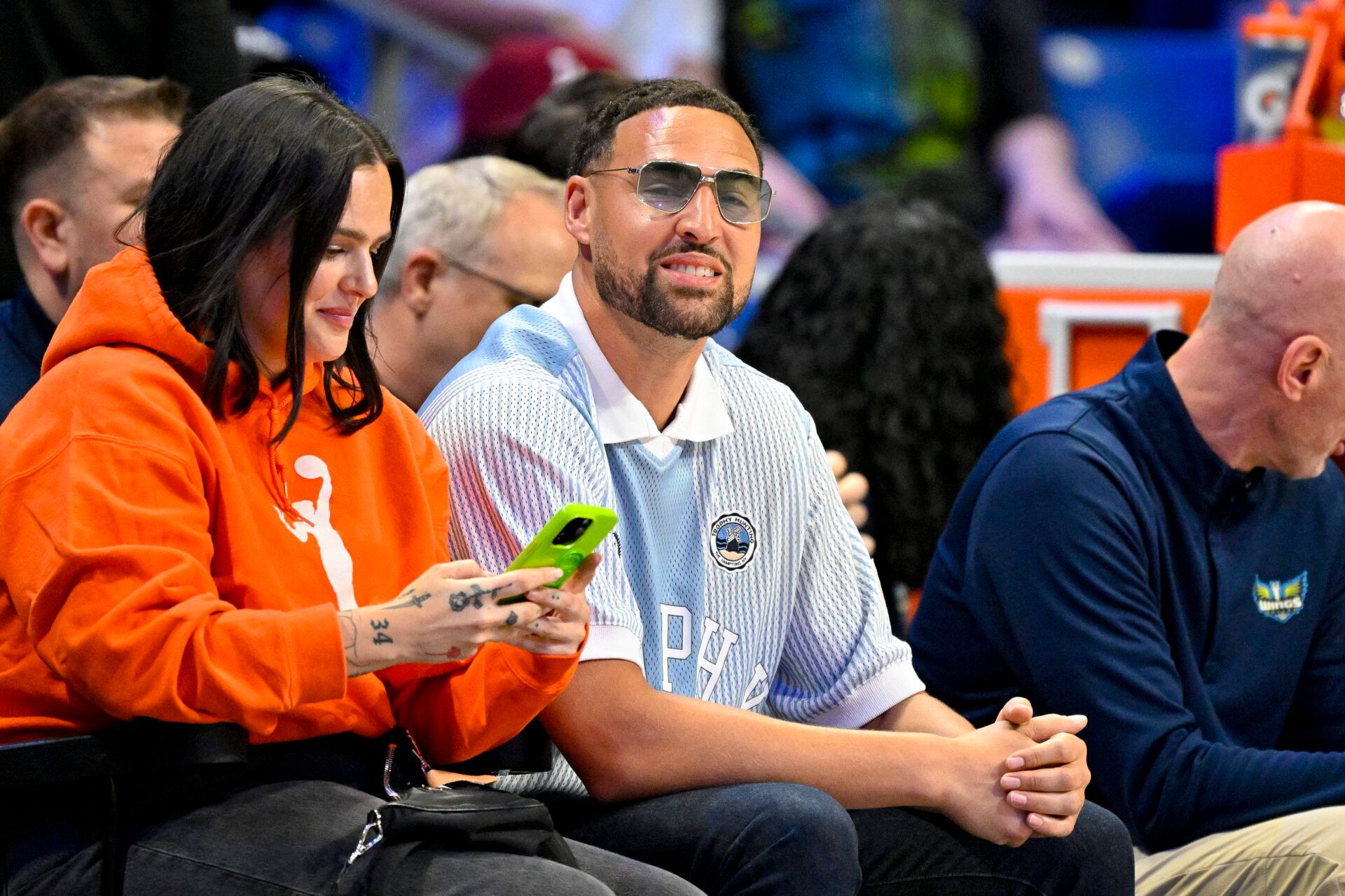 Dallas Mavericks guard Klay Thompson watches the game between the Dallas Wings and the Chicago Sky during the first half at College Park Center.