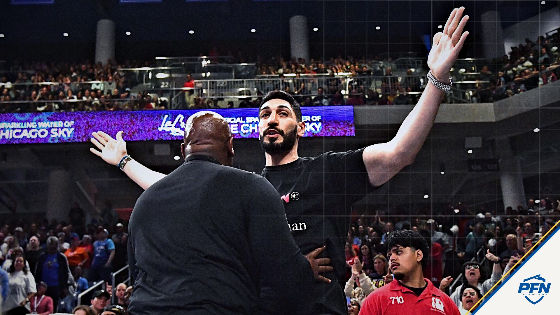 Turkish-American former basketball player and human rights activist Enes Kanter Freedom reacts as he is removed from the arena during the second half against the Indiana Fever at Wintrust Arena.