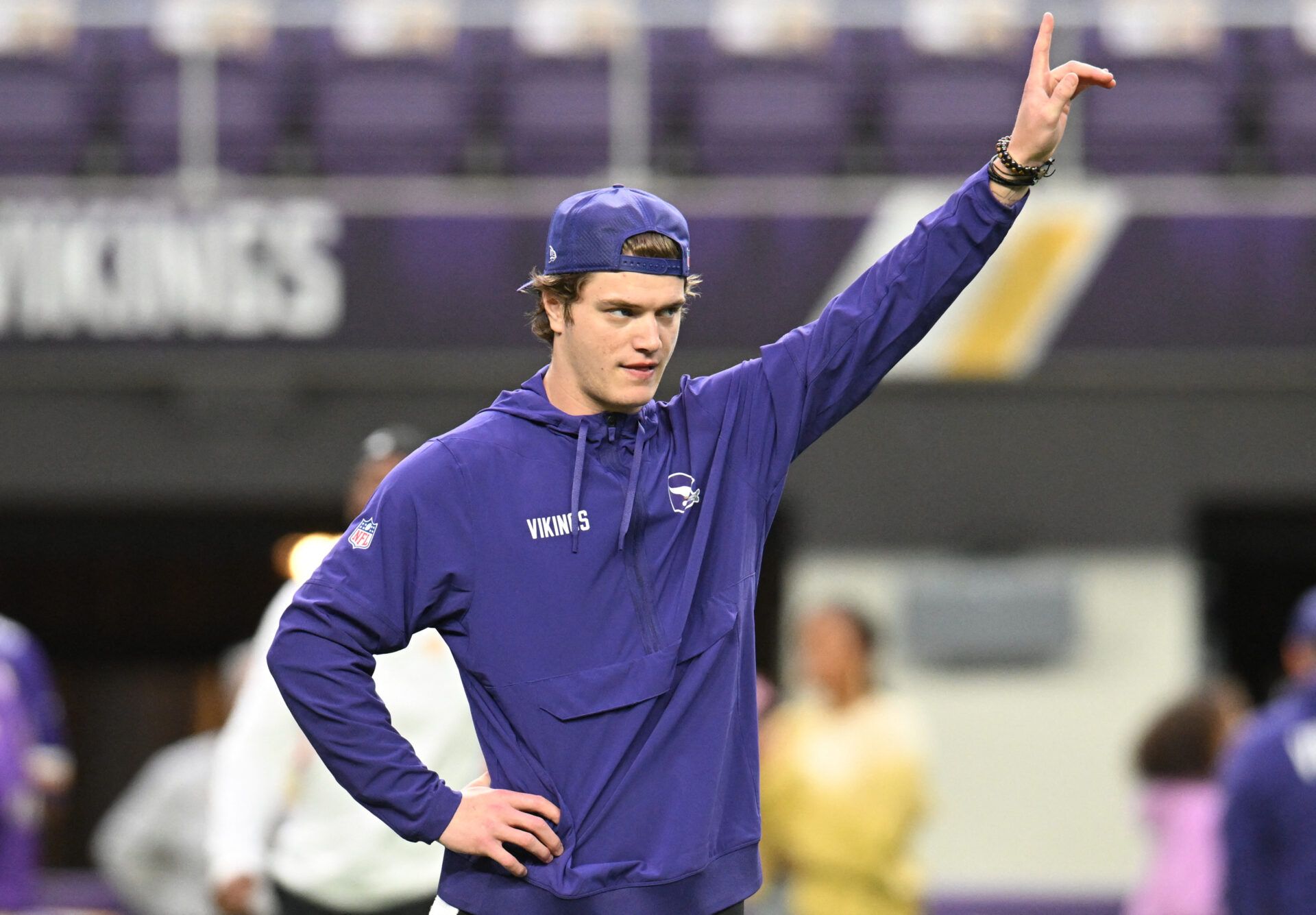 Minnesota Vikings quarterback J.J. McCarthy (9) warms up prior to the game against the Green Bay Packers at U.S. Bank Stadium.