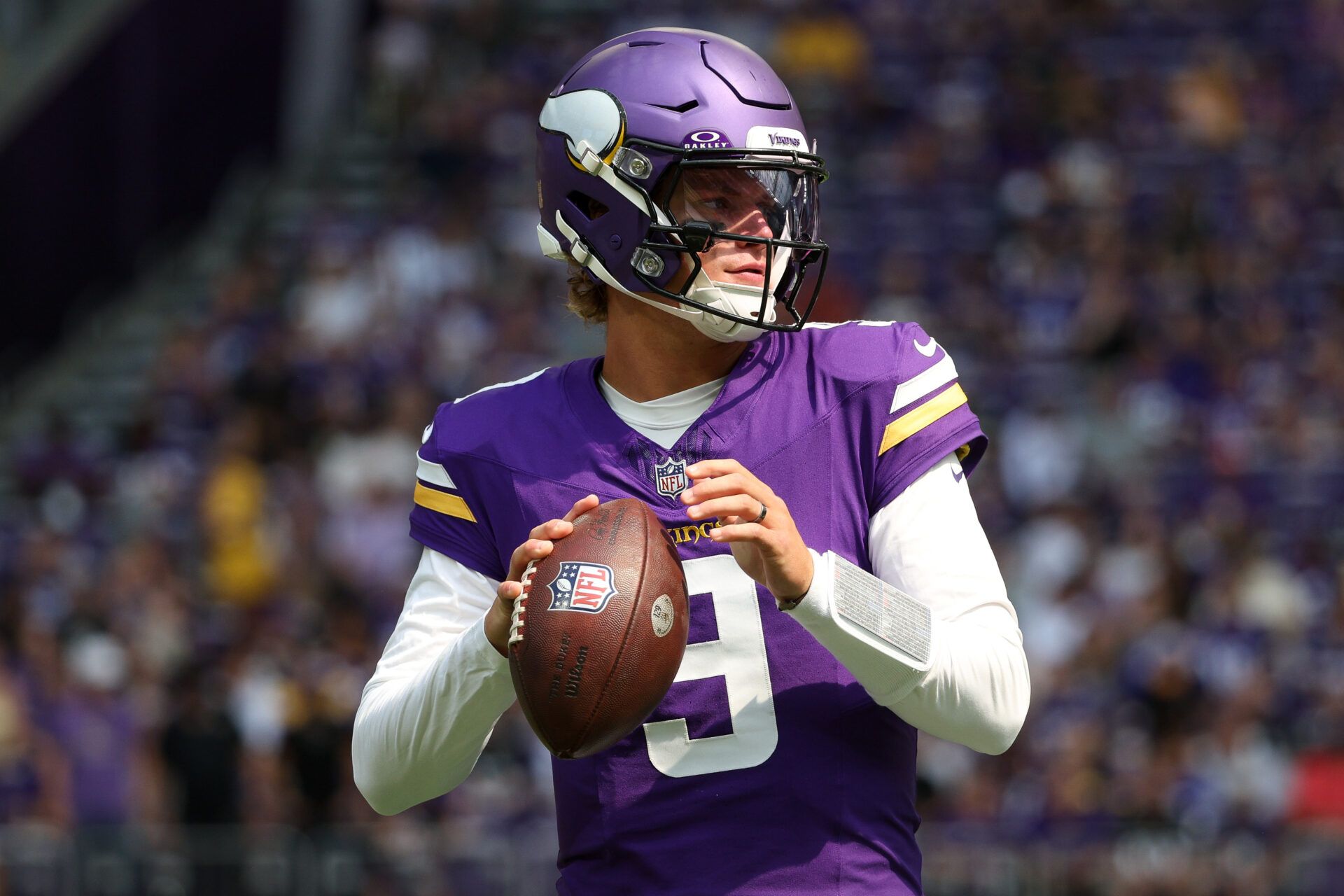 Minnesota Vikings quarterback J.J. McCarthy (9) warms up before the game against the Baltimore Ravens at U.S. Bank Stadium.
