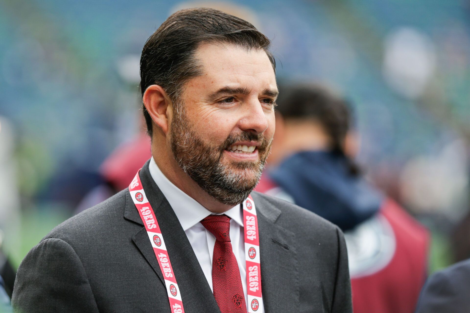 San Francisco 49ers CEO Jed York stands on the sideline during pregame warmups against the Seattle Seahawks at Lumen Field.