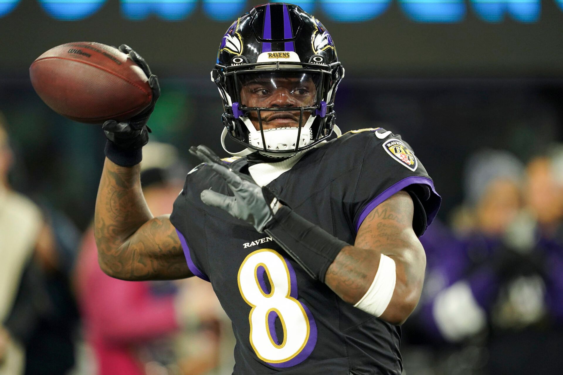 Baltimore Ravens quarterback Lamar Jackson (8) warms up prior to the game against the New England Patriots at M&T Bank Stadium.