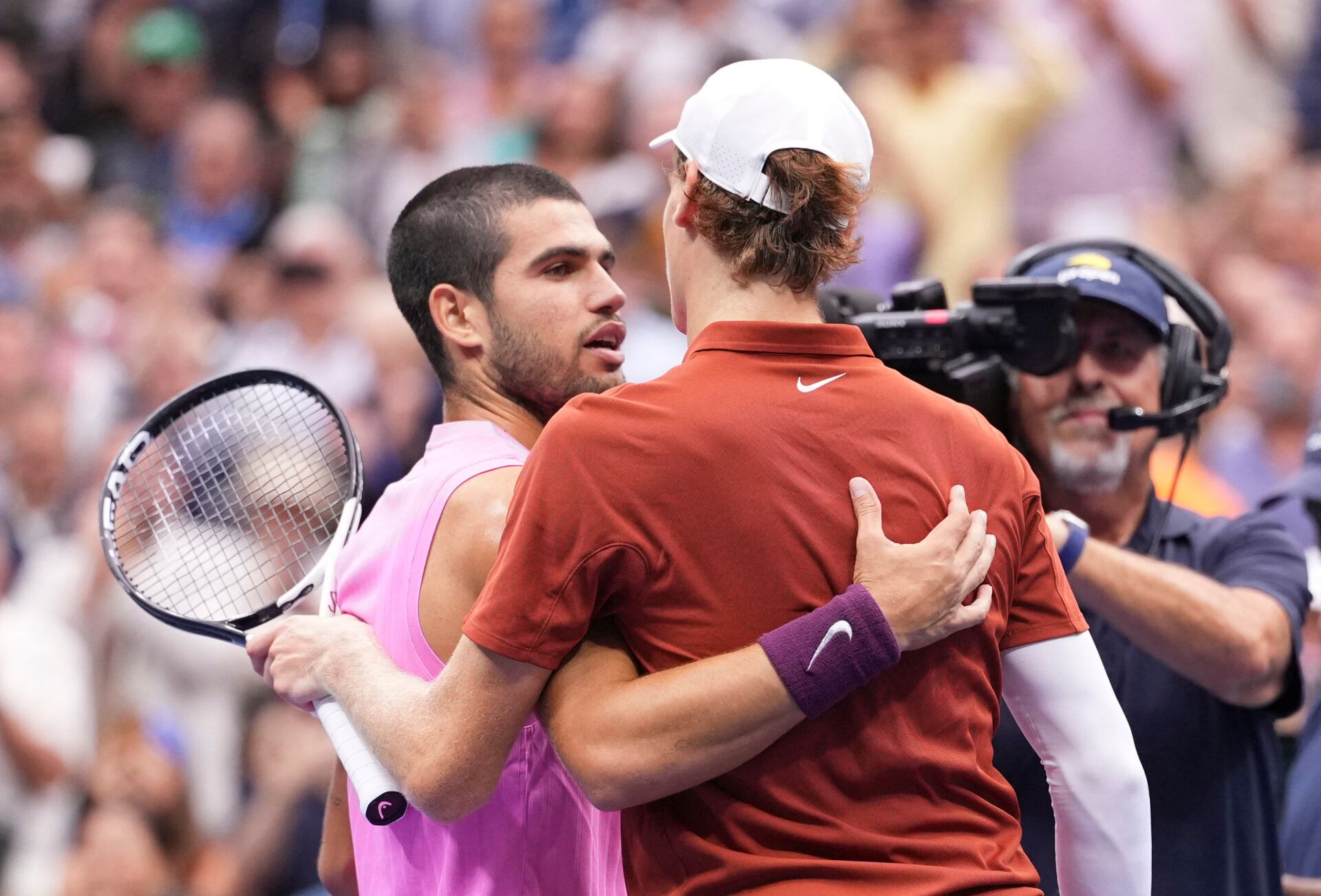 Carlos Alcaraz (ESP) hugs Jannik Sinner (ITA) after the final of mens singles at Billie Jean King National Tennis Center.