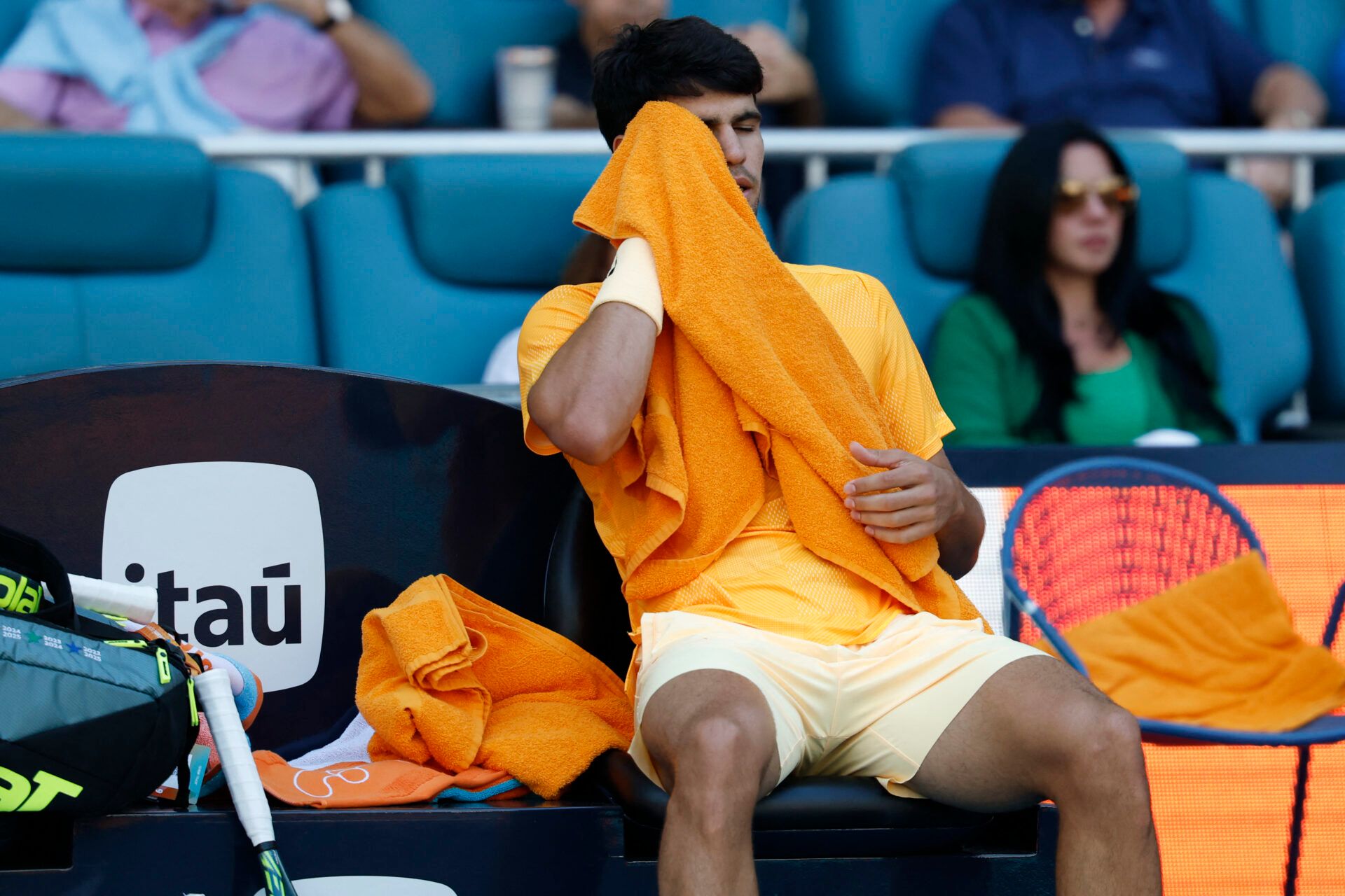 Carlos Alcaraz (ESP) wipes his face in his player's chair during a changeover against Sebastian Korda (USA) (not pictured) on day six of the 2026 Miami Open at Hard Rock Stadium.