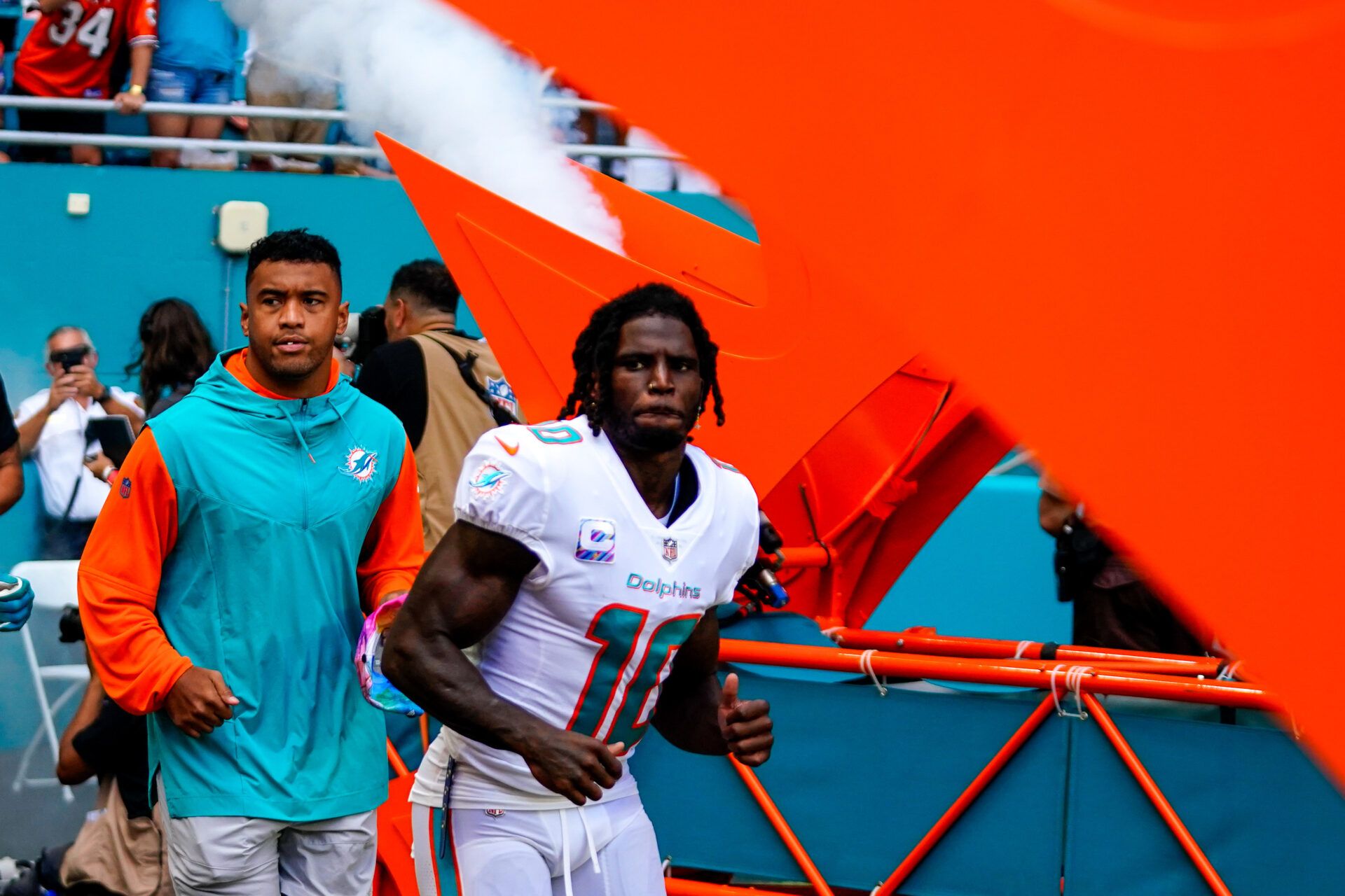 Miami Dolphins quarterback Tua Tagovailoa (1) and wide receiver Tyreek Hill (10) enter the field prior to a game against the Minnesota Vikings at Hard Rock Stadium.