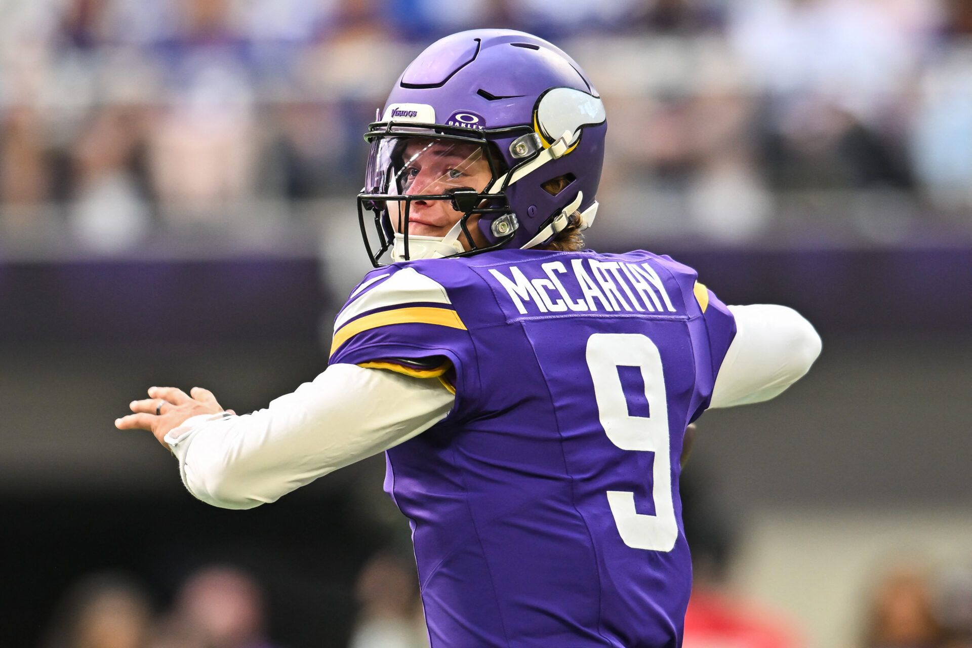 Minnesota Vikings quarterback J.J. McCarthy (9) looks to throw a pass against the Baltimore Ravens during the first quarter at U.S. Bank Stadium.