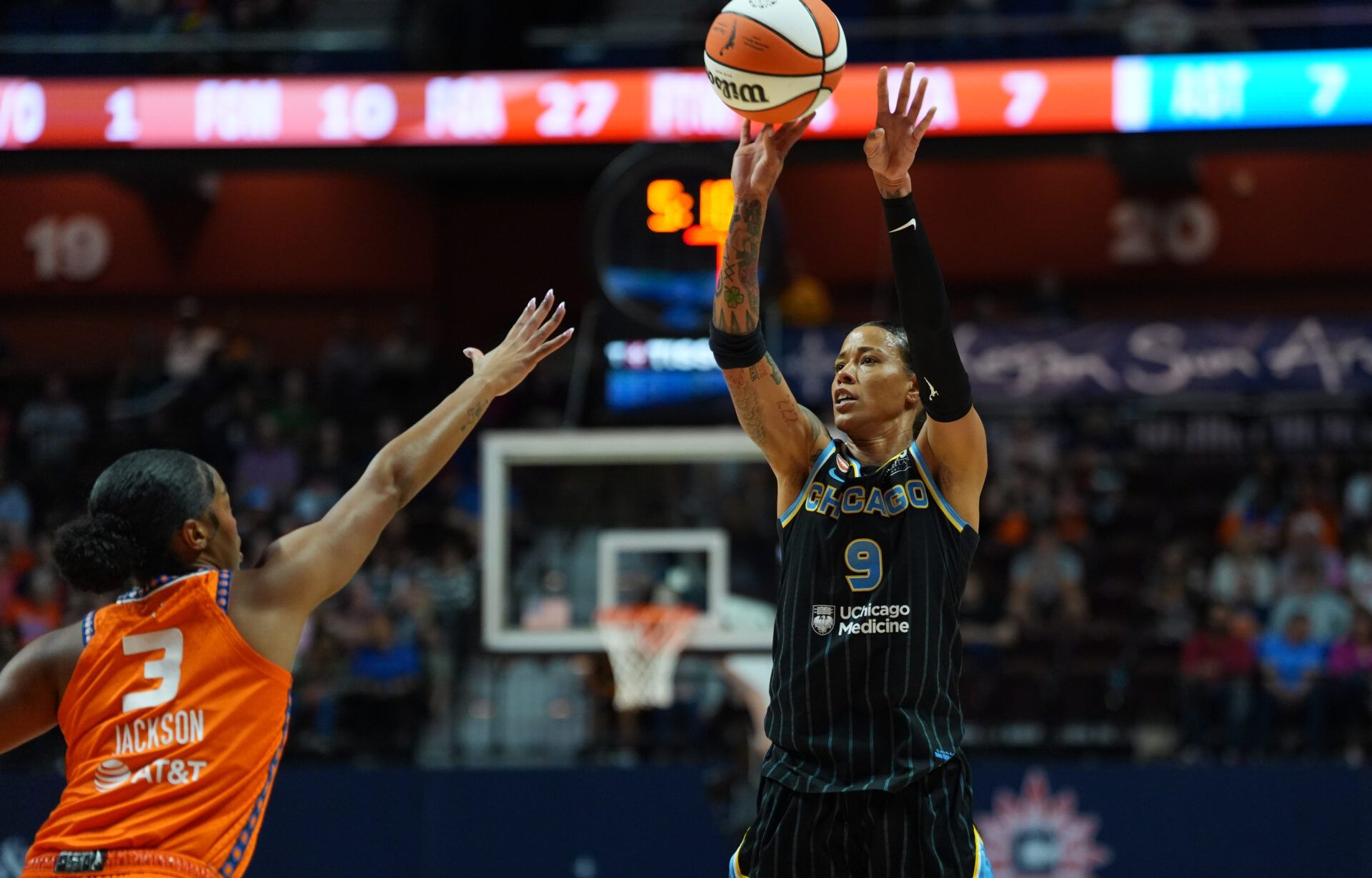 Chicago Sky guard Natasha Cloud (9) shoots the ball against Connecticut Sun guard Ashlon Jackson (3) in the first half at Mohegan Sun Arena.