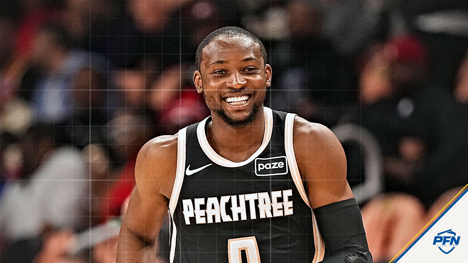 Atlanta Hawks forward Jonathan Kuminga (0) reacts after making a three point shot against the Washington Wizards during the first half at State Farm Arena.