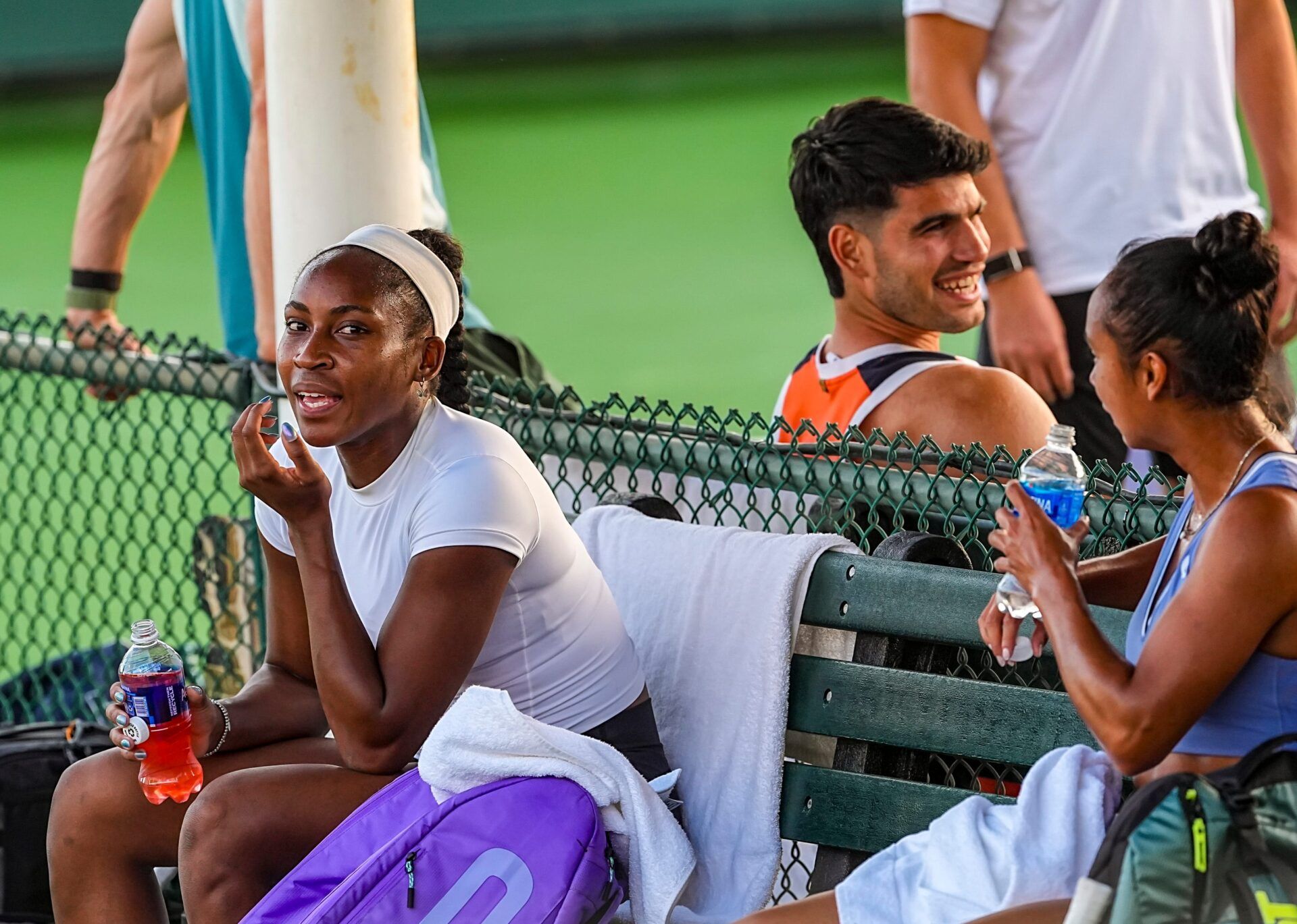 Coco Gauff, Leylah Fernandez and Carlos Alcaraz share a laugh together during a break in their practice sessions at the BNP Paribas Open in Indian Wells, Calif., Wednesday, March 4, 2026.