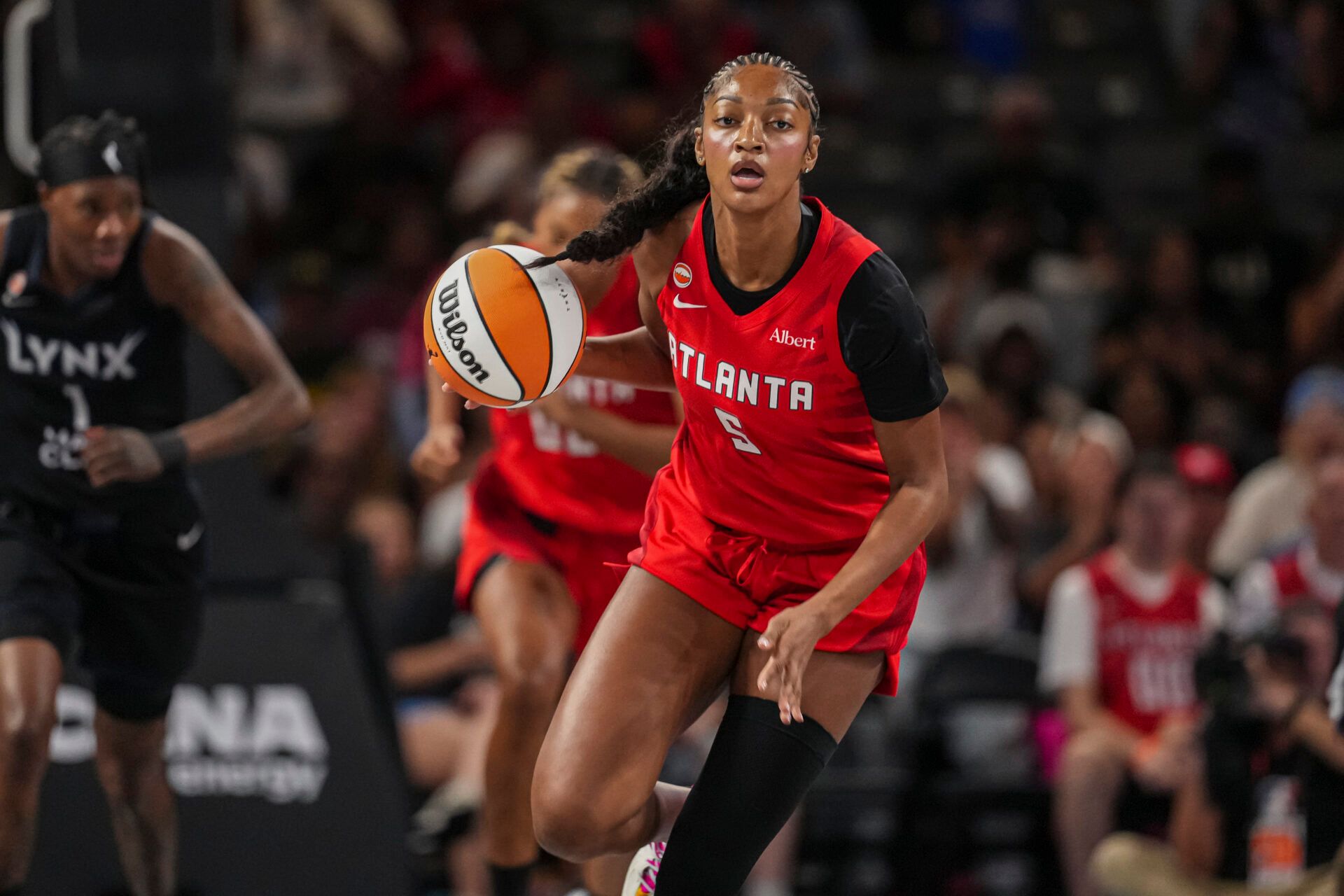 Atlanta Dream forward Angel Reese (5) brings the ball up the court against the Minnesota Lynx during the first half at Gateway Center Arena at College Park.