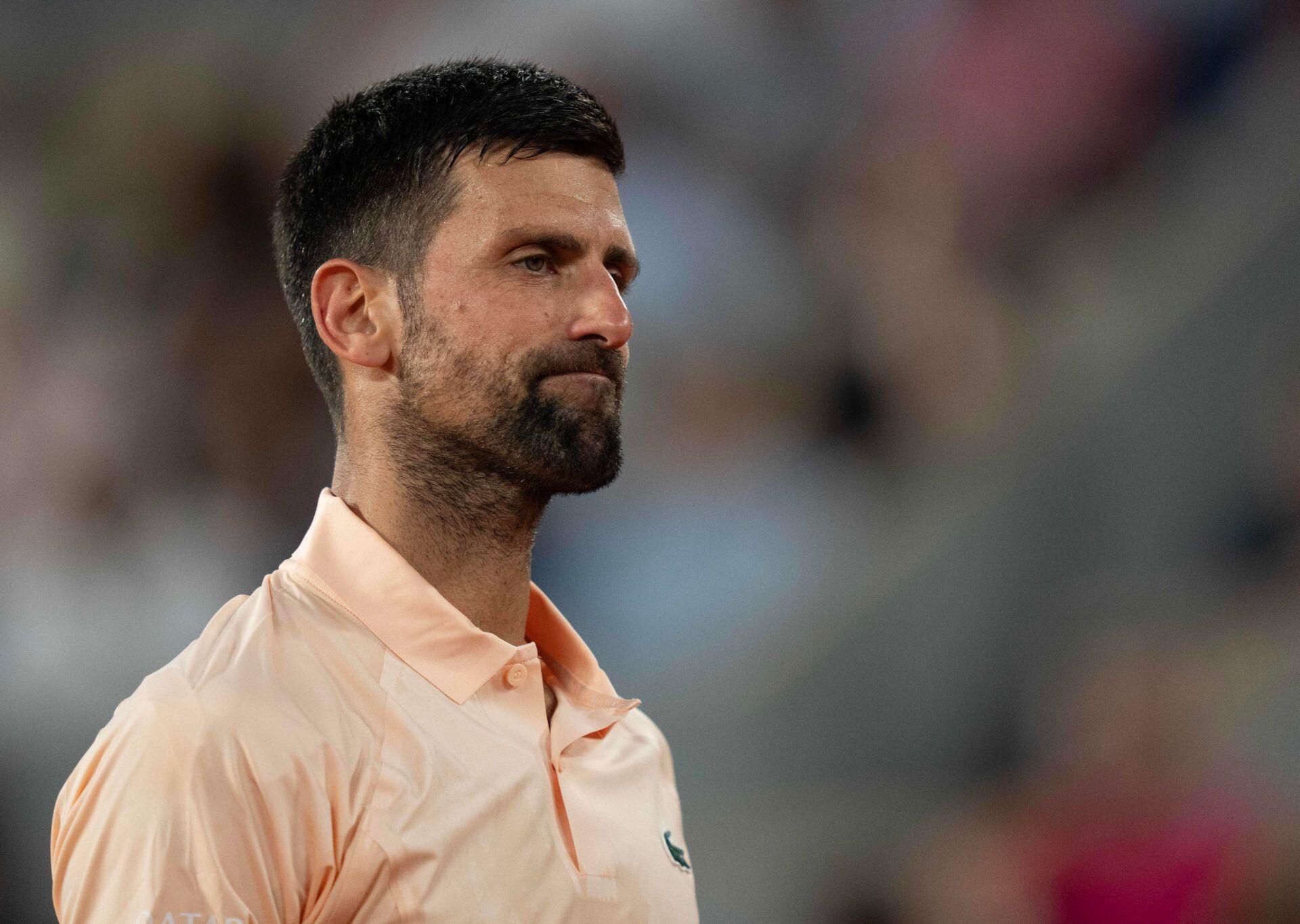 Novak Djokovic of Serbia reacts during his first round match against Giovanni Mpetshi Perricard of France on day one at Stade Roland Garros.