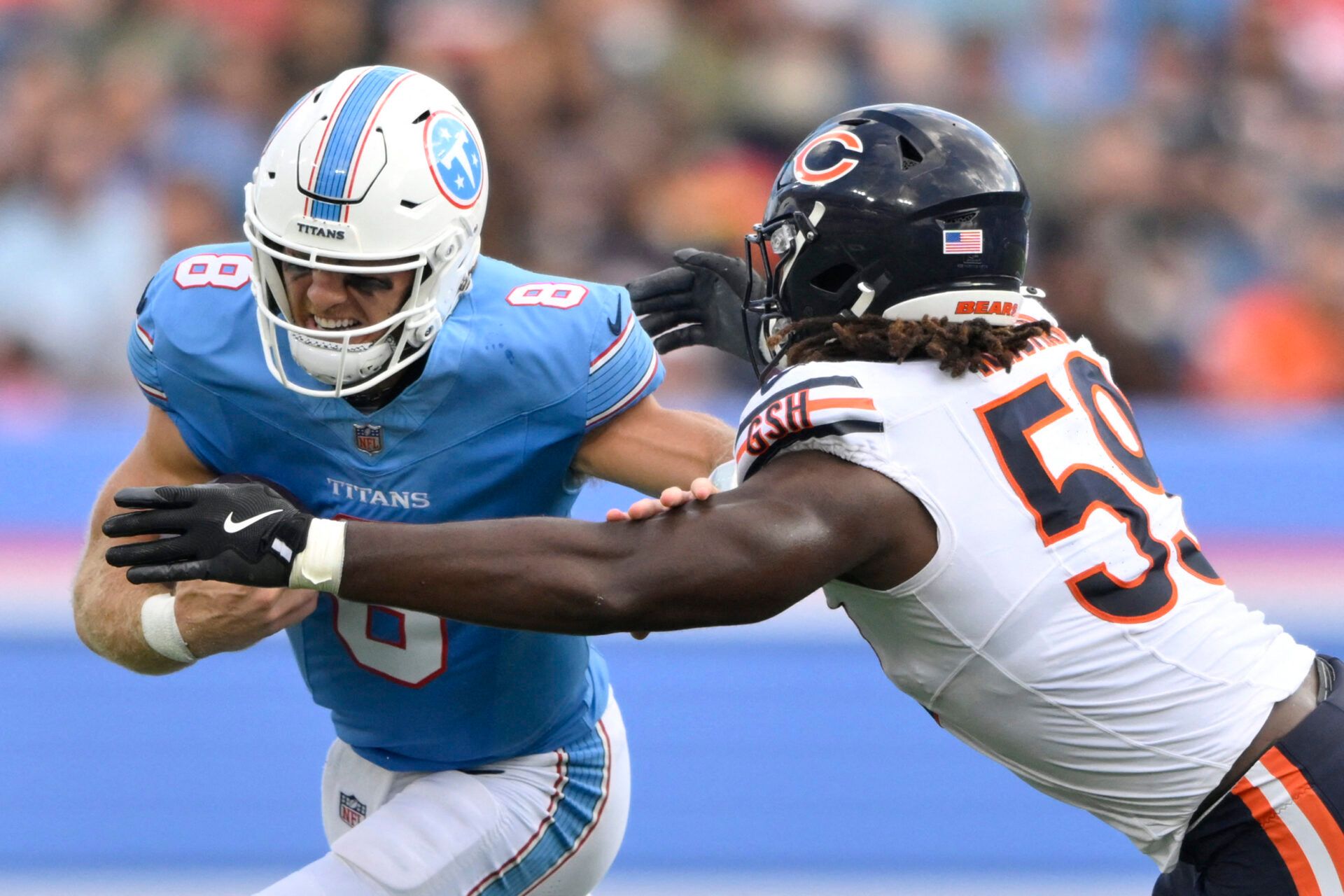 Tennessee Titans quarterback Will Levis (8) runs against Chicago Bears defensive line Jamree Kromah (59) during the second quarter at Nissan Stadium.