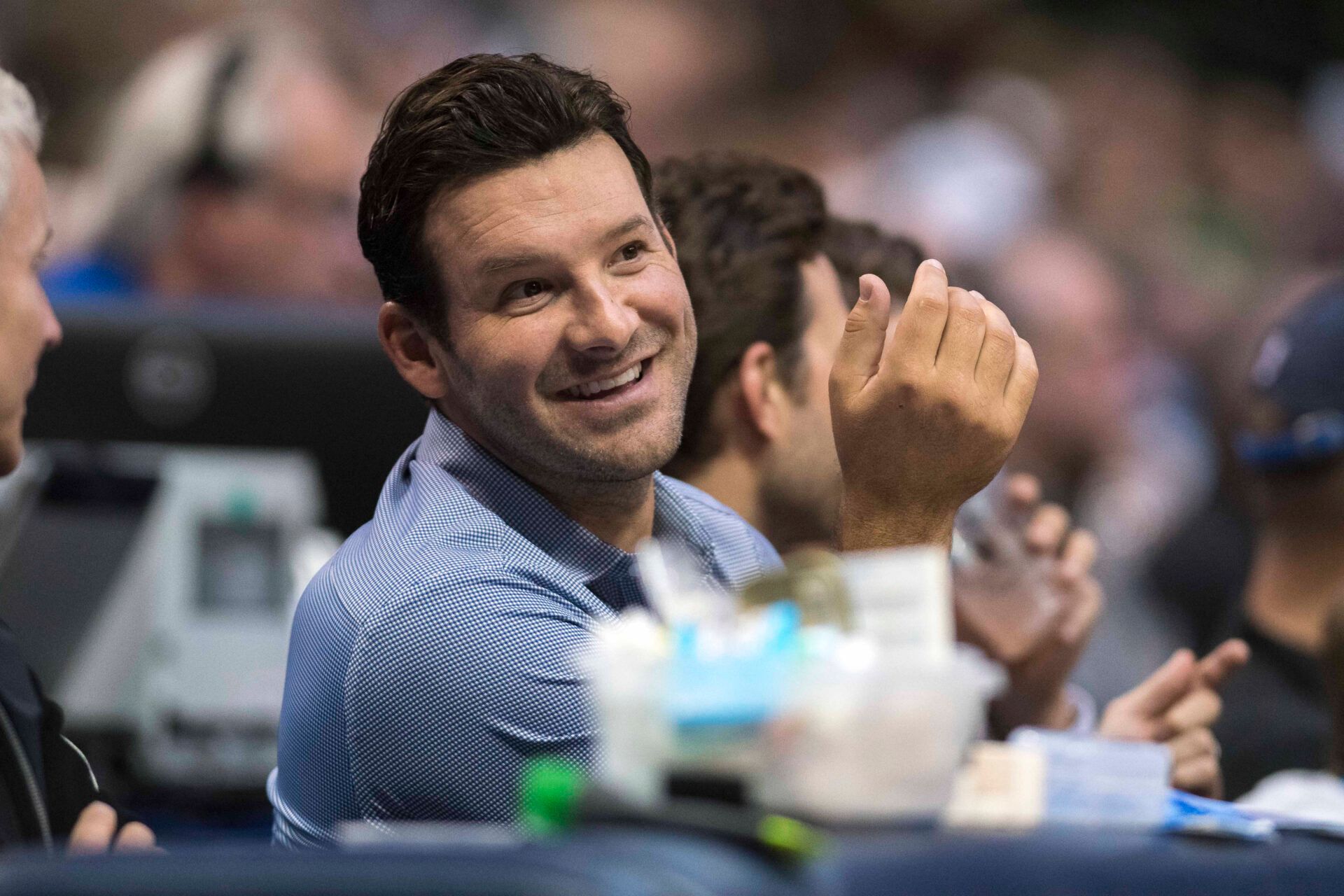 Former Dallas Cowboys quarterback Tony Romo watches the game between the Dallas Mavericks and the Boston Celtics at the American Airlines Center. The Celtics defeat the Mavericks 110-102.