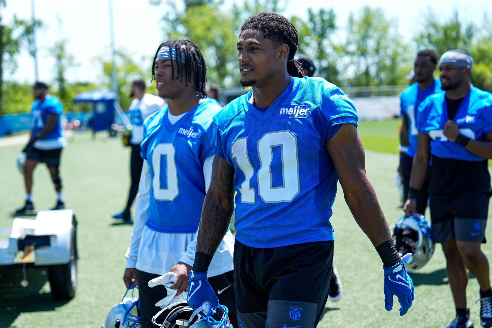 Detroit Lions running back Isiah Pacheco (10) walks off the field with running back Jahmyr Gibbs (0) after practice during OTAs at Meijer Performance Center in Allen Park on Friday, May 29, 2026.