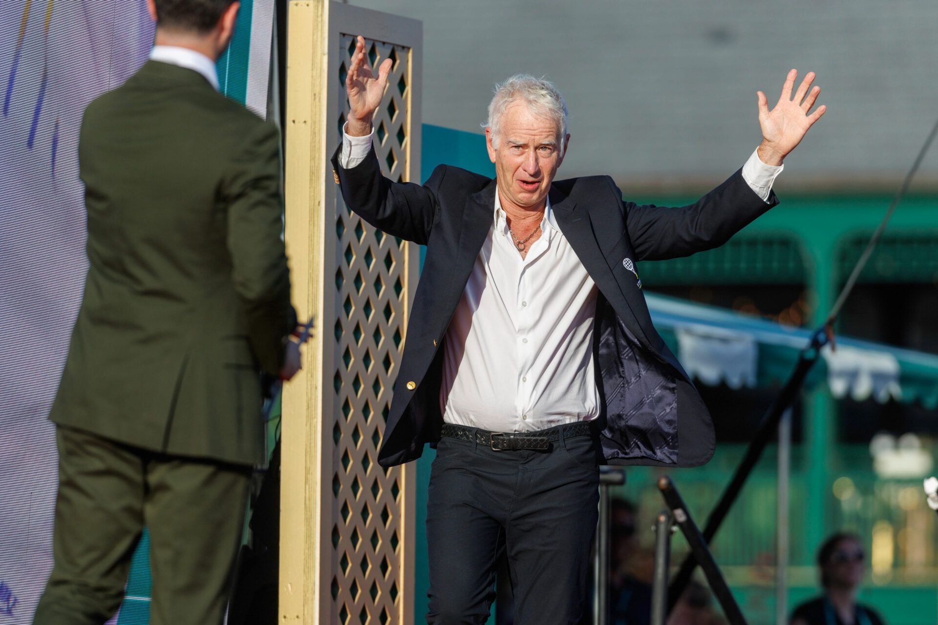 Roger Federer and Mary Carillo are inducted into the International Tennis Hall of Fame in Newport, RI, on August 29. On hand for the event is tennis great John McEnroe.