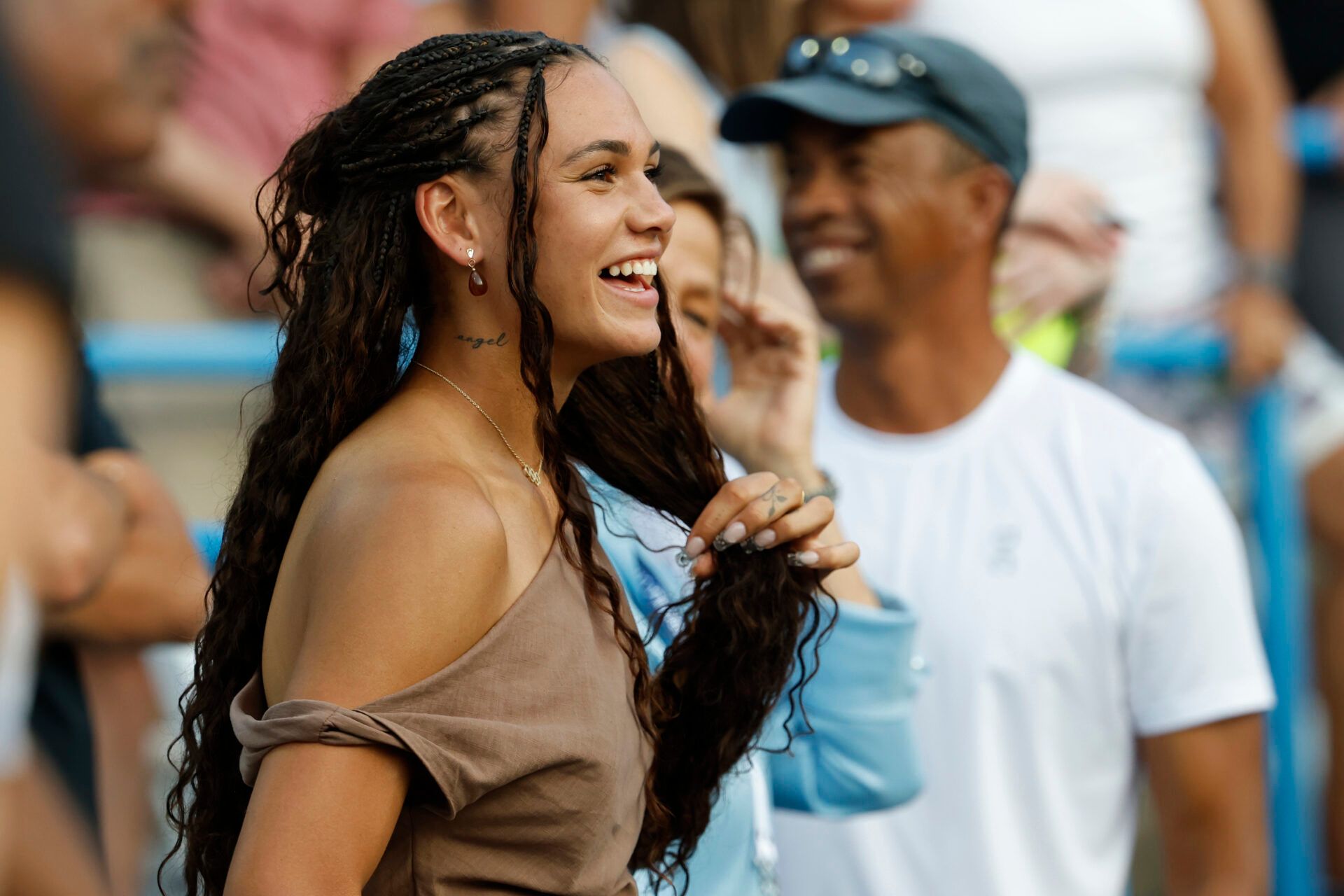 Washington Spirit forward Trinity Rodman, girlfriend of Ben Shelton (USA)(not pictured), smiles in his player's box after the match against Mackenzie McDonald (USA)(not pictured) in a men's singles match on day two of the Mubadala Citi DC Open at Rock Creek Park Tennis Center.
