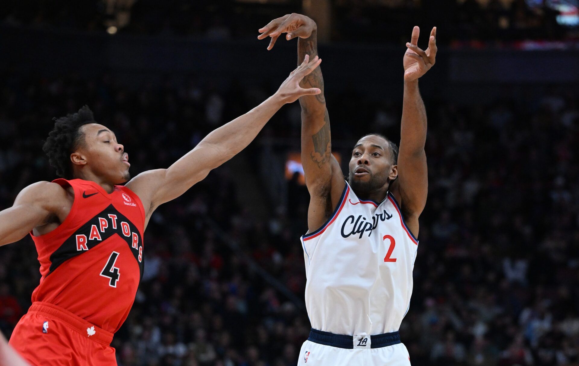 Los Angeles Clippers forward Kawhi Leonard (2) shoots the ball as Toronto Raptors forward Scottie Barnes (4) defends in the second half at Scotiabank Arena.