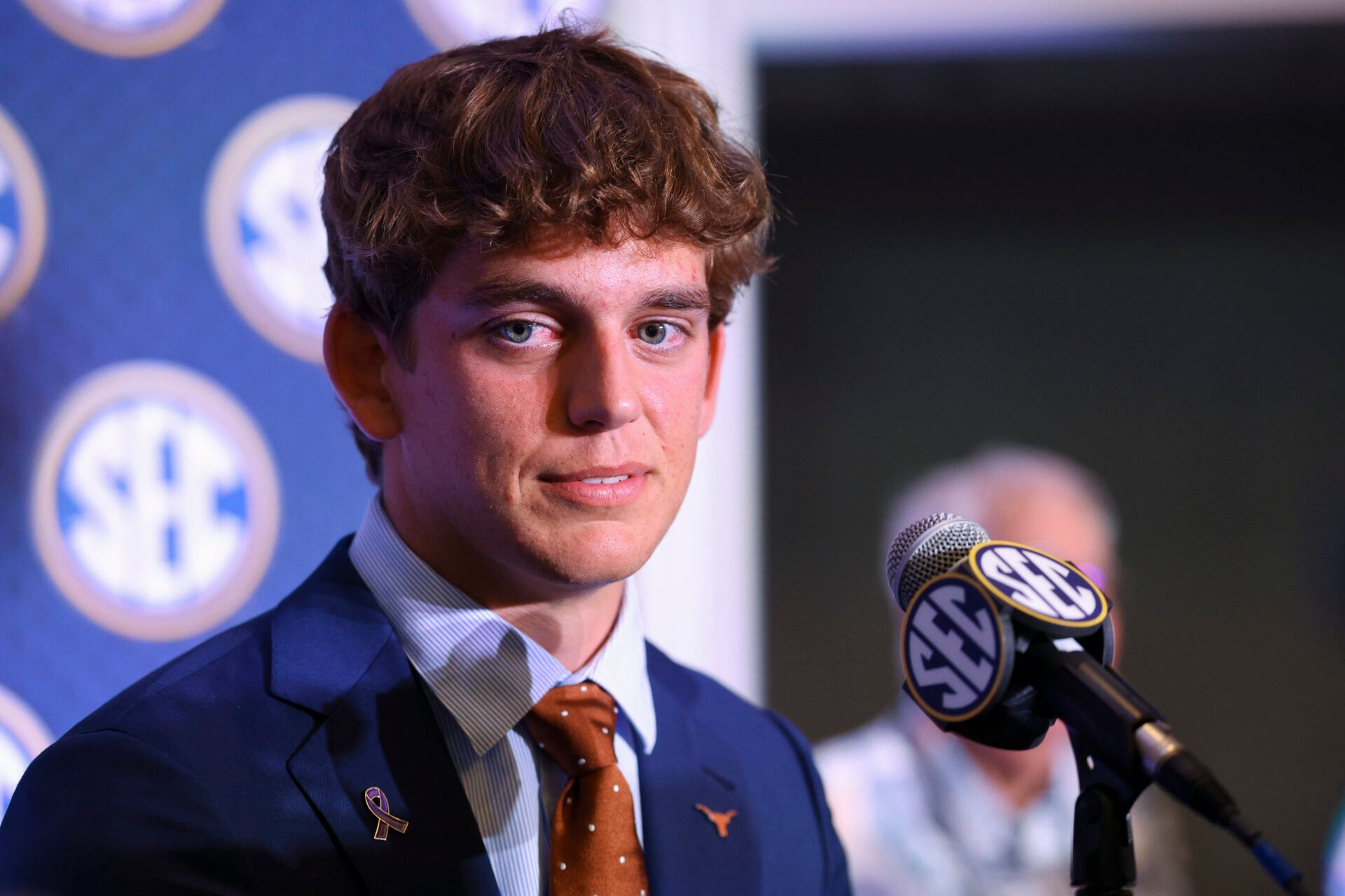 Texas Longhorns quarterback Arch Manning (16) speaks to the press during SEC Football Kickoff Media Day at the Tampa Marriott.