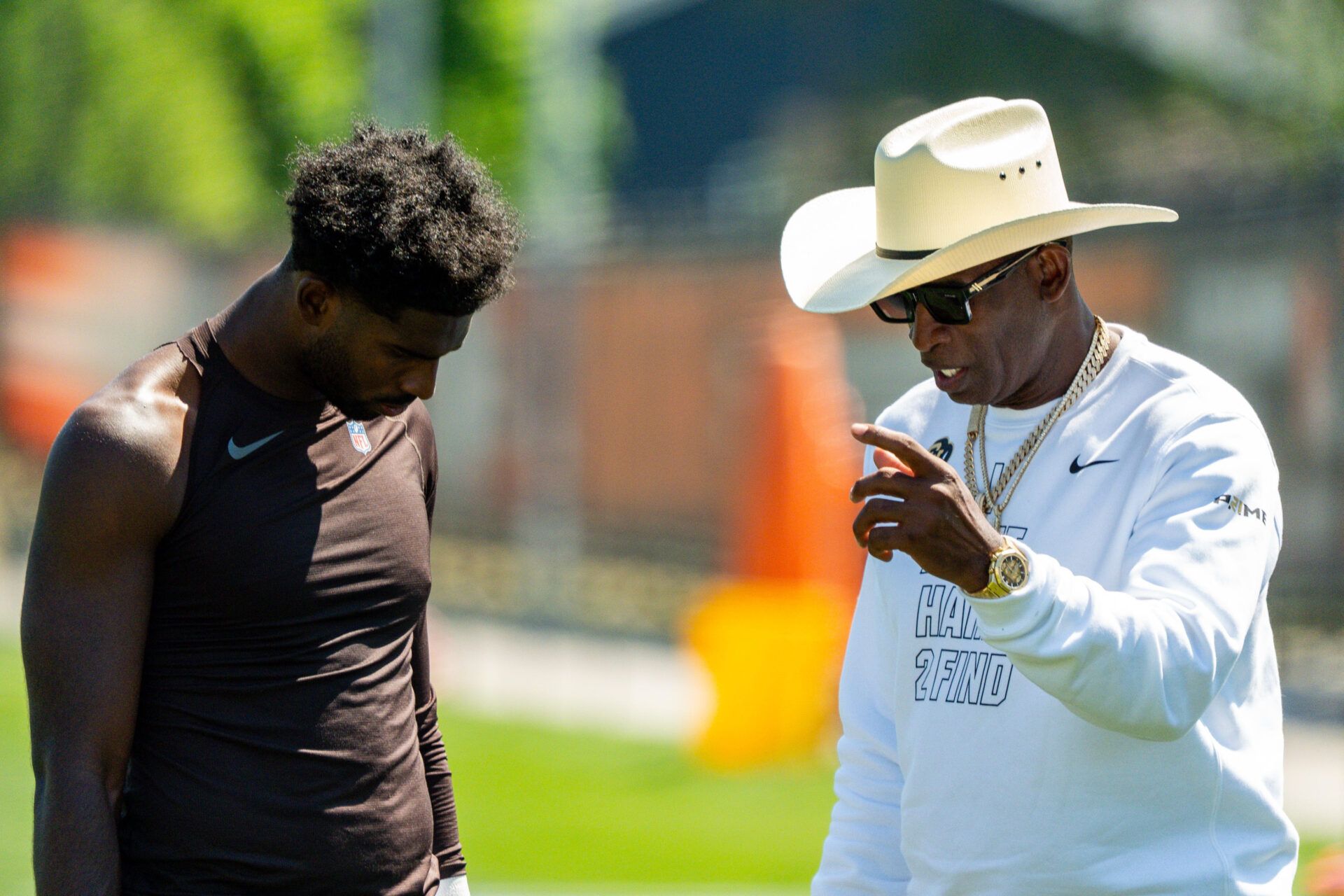 Deion Sanders spends time with his son, Cleveland Browns quarterback Shedeur Sanders (2) at the conclusion of the second day of training camp, July 30, 2026, in Berea, Ohio.