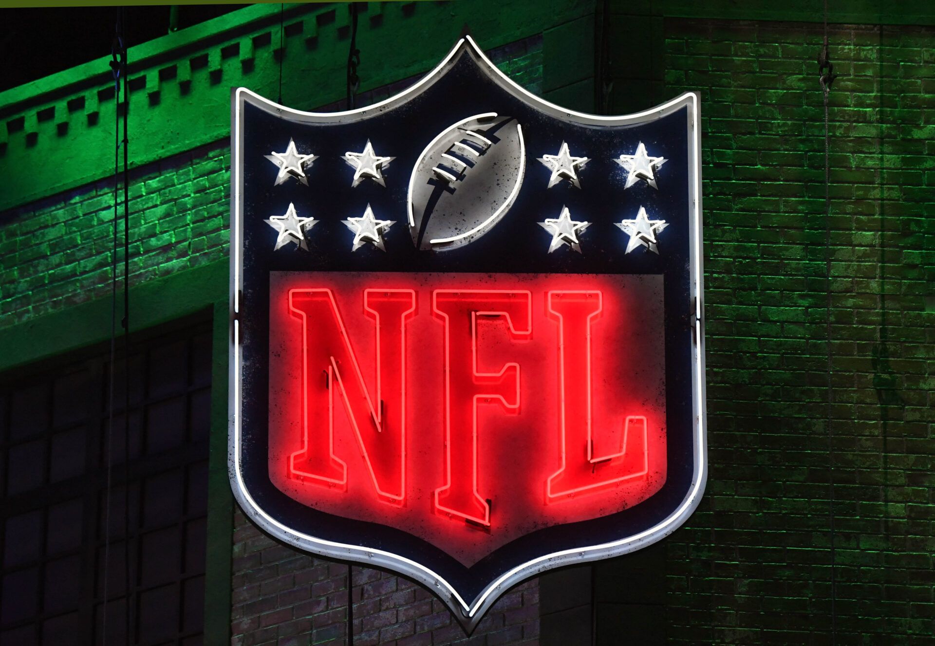 Detailed view of neon NFL shield logo during the first round of the 2019 NFL Draft in downtown Nashville.