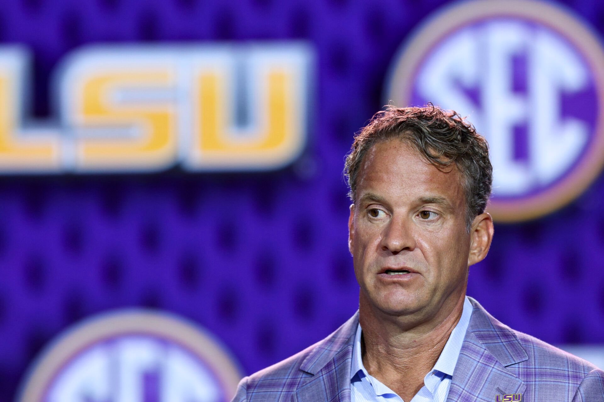 LSU Tigers head coach Lane Kiffin speaks to the press during SEC Football Kickoff Media Day at the Tampa Marriott.