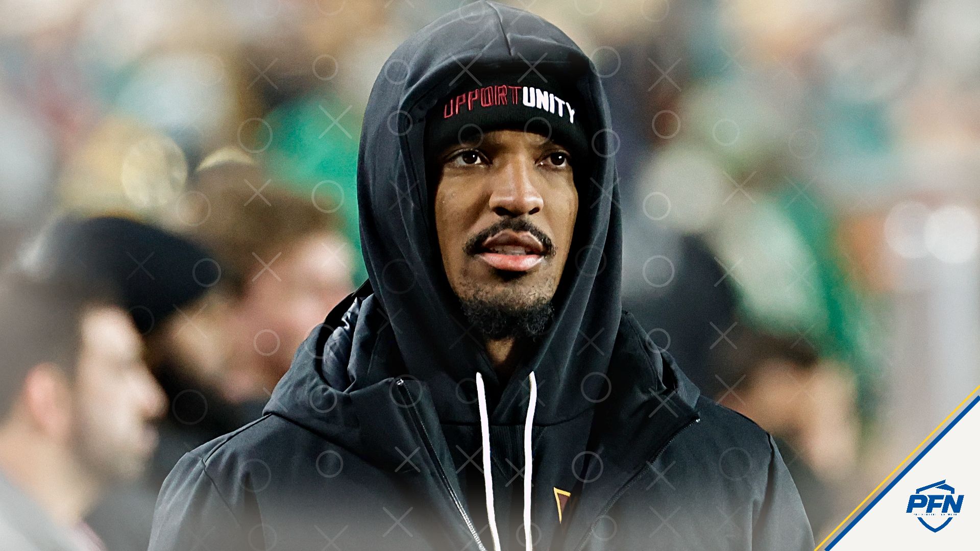 Washington Commanders quarterback Jayden Daniels (5) looks on from the sidelines during the final minutes of the second half against the Philadelphia Eagles at Northwest Stadium.