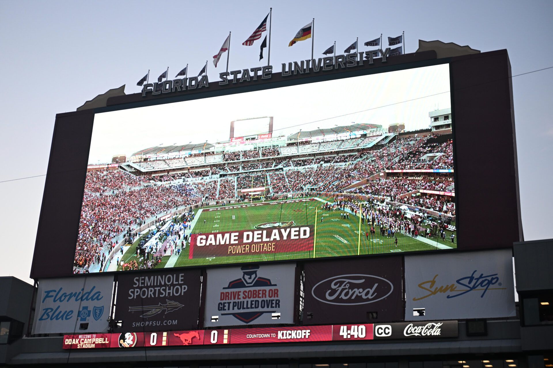The videoboard announces the game between the Florida State Seminoles and the Southern Methodist Mustangs is delayed due to power outage at Doak S. Campbell Stadium.